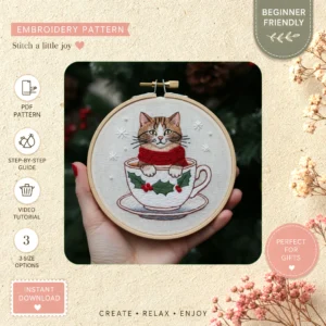 Main preview of festive cat mug holiday hand embroidery pattern showing cat and wreath in a hand stitched hoop art design