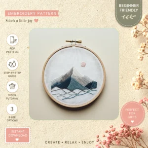 Main preview of mountain meadow nature's pastoral hand embroidery pattern showing wildflowers, mountain, landscape, river, and meadow in a hand stitched hoop art design